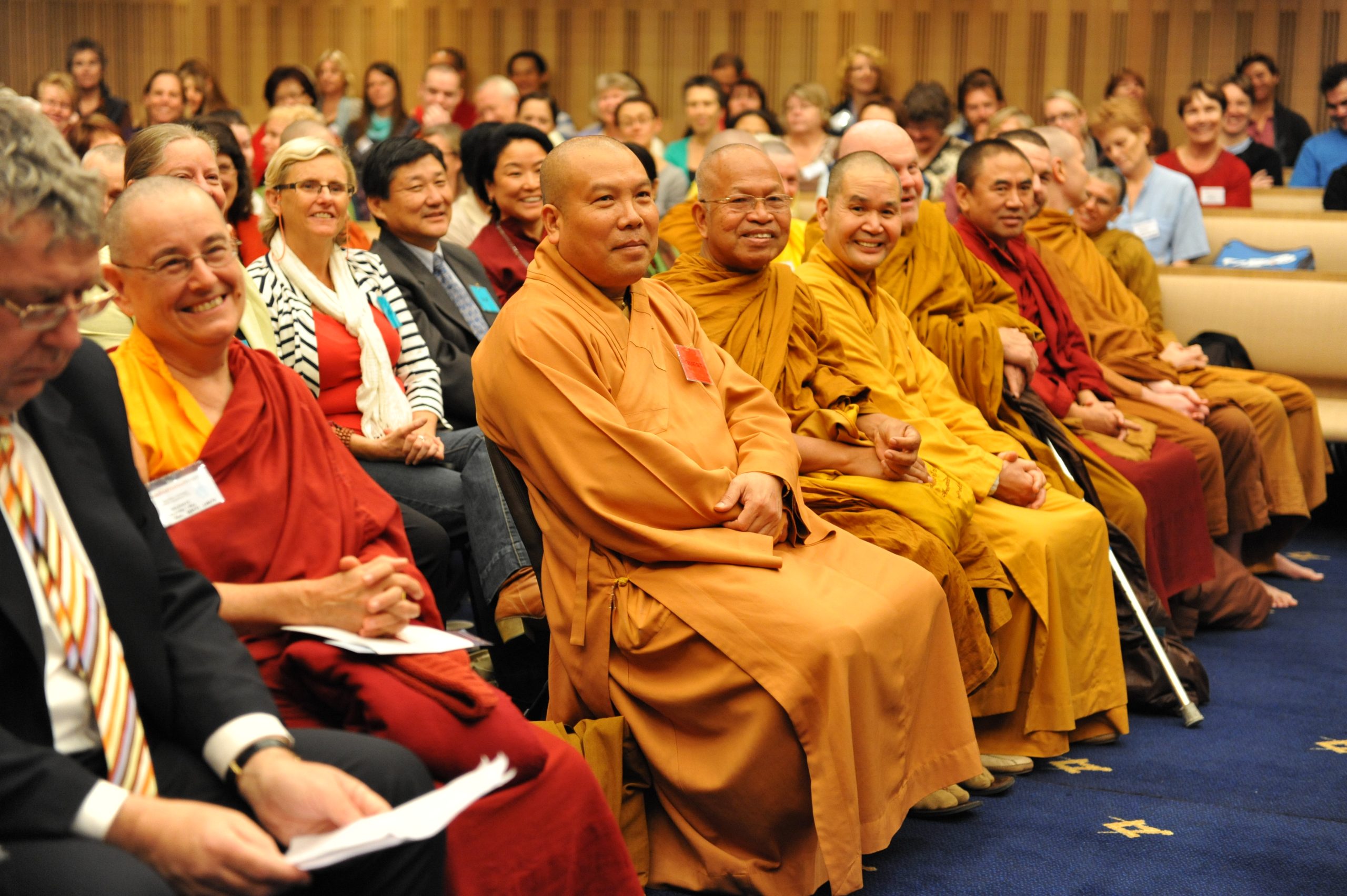 Image from a BCNSW event with pictures of monks and people